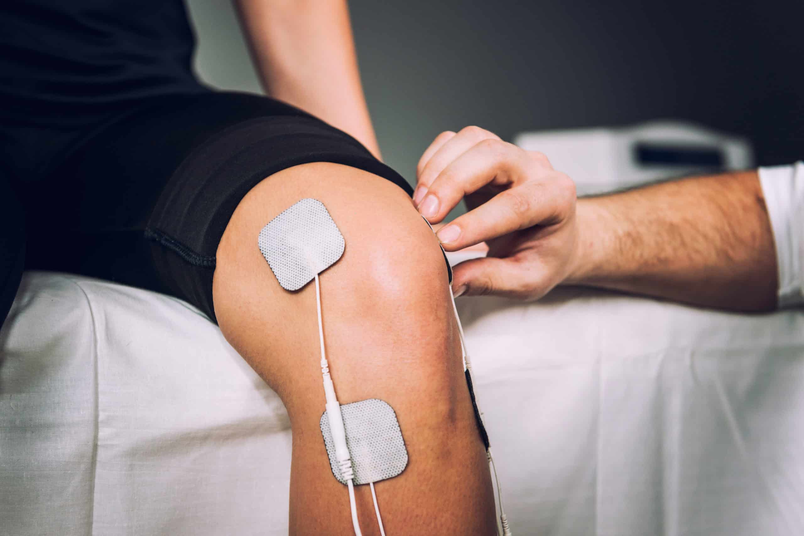 Athlete using EMS device during 48-hour post-training recovery phase